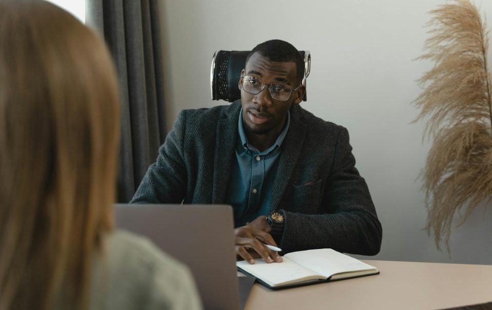 man talking to an applying woman